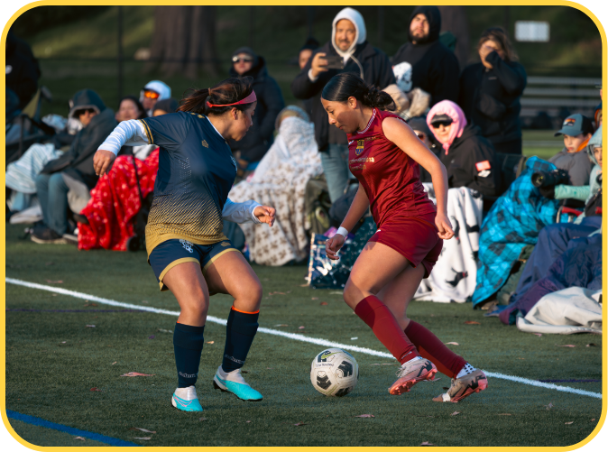 2 girls playing soccer